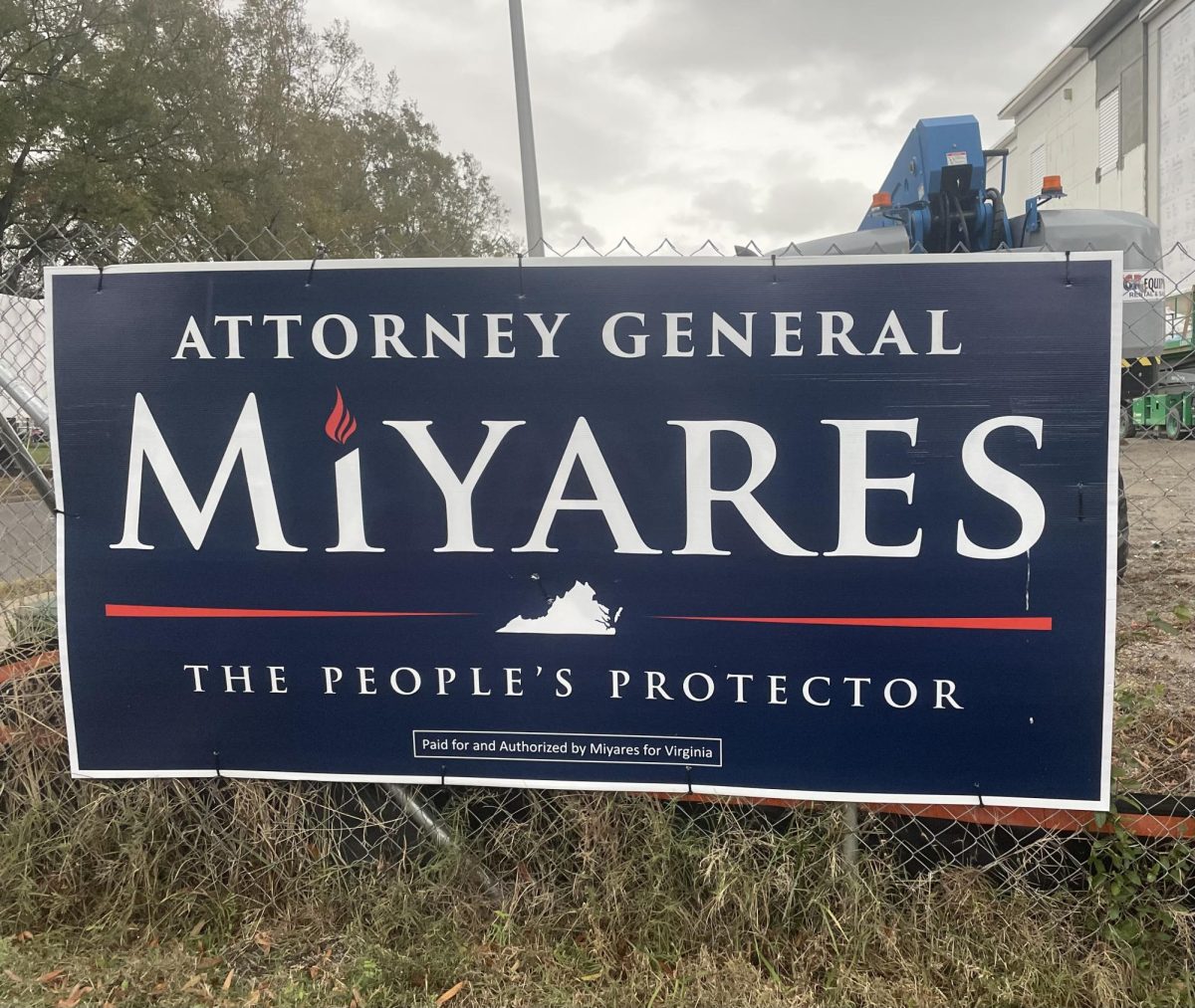 A Jason Miyares campaign sign rests on the chain-link fence of construction sight off General Booth Blvd on Oct. 28, 2025. Early voting is open until Nov 1, 2025, and election day is Nov 4, 2025.