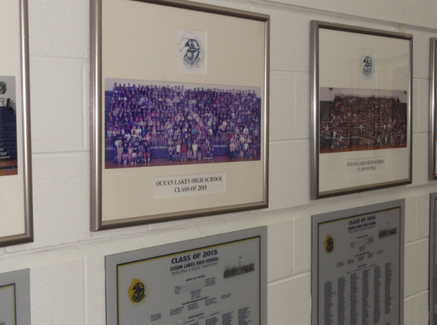 The Class of 2015’s reunion photo and class plaque located near the main staircase. According to Leslie Samuelson, she recalls the Class of 2015 to consist of around 700 students. “Your life is your life, especially after high school,” Leslie Samuelson said.