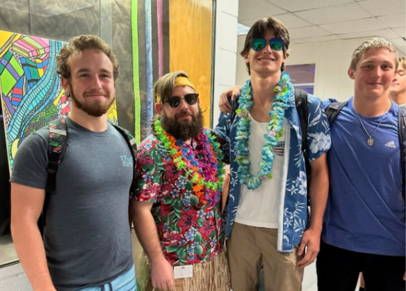 From left to right: Ben Rosenberg, Michael Mosely, Aiden Nichols and Max Deangelo stand outside 137 on September 4. The Spirit day was Surf vs Turf and students were expected to dress in beach or country clothing. Photo taken by Anna Daubenspeck.