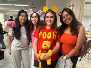 From left to right: Namia Khan, Anna Keck, Sophia Altinok and Raizel Dino pose for a picture outside 127 on September 2. The spirit day was Disney Day, and the students showed up to school dressed as their favorite Disney characters.
