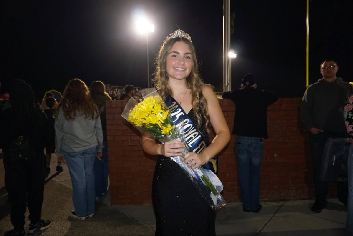 Senior homecoming court candidate Abbie Tignor moments after being crowned a Royal Fin. She walked down the field at halftime on Oct. 3, 2025, during the Ocean Lakes versus Cox homecoming football game. 