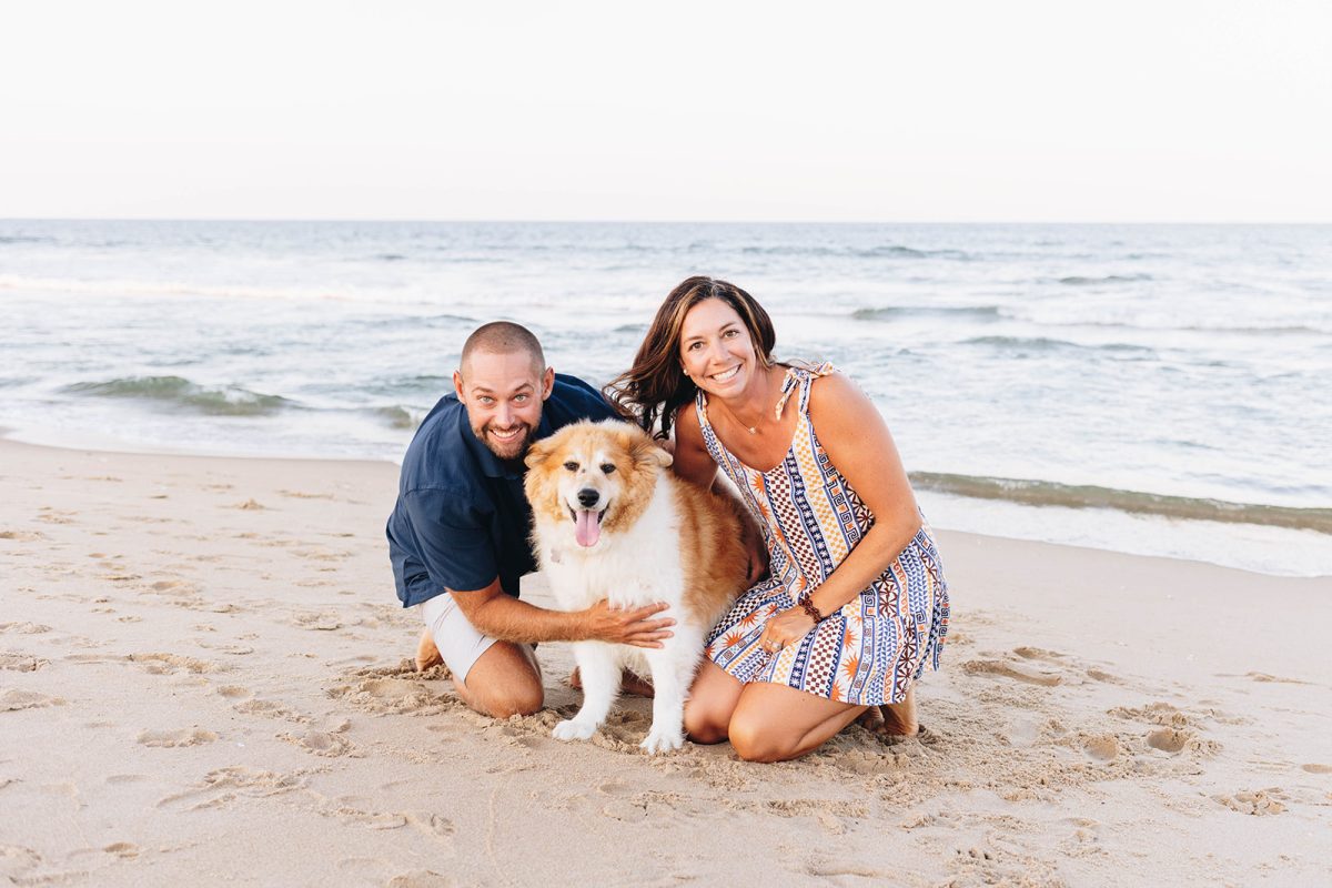 From left to right: Mark Moore, Reggie Moore and Amber Moore smile for a photo while enjoying the summer of 2025 at Sandbridge Beach. Photo taken by Danielle McVey.