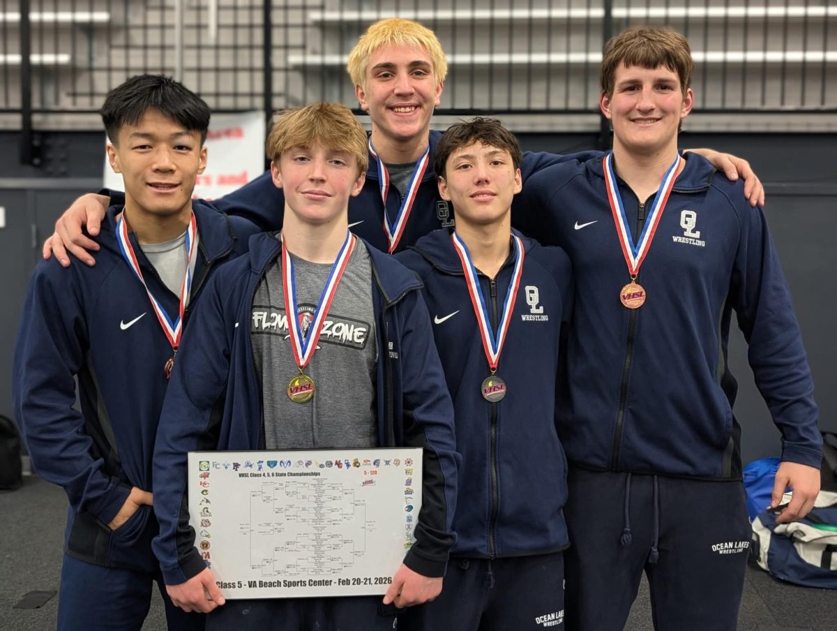 From left to right: senior Noah Xiong,  freshman Matthew DeAngelo, senior Wyatt Early, junior Skiles Burkhead, and senior Michael Trusty smile for a photo at the Virginia Beach Sports Center during the Virginia Beach Wrestling 5A State Championship Tournament on Feb. 21, 2026. Ocean Lakes finished in fifth place with 92.5 points as a team.
