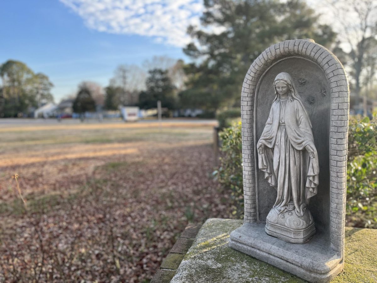 A photo captures a miniature statue with the likeness of the Virgin Mary at St. Nicholas Catholic Church in King’s Grant. She is revered in both Christian and Islamic faiths.