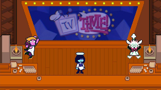 This scene depicts a minigame in the aforementioned TV world, during Chapter Three antagonist (Ant) Tenna’s game show. It involves moving Kris (center) to catch falling food items cooked by Ralsei (right) while avoiding the fireballs accidentally created by Susie (left) in order to earn points. Courtesy of Toby Fox.