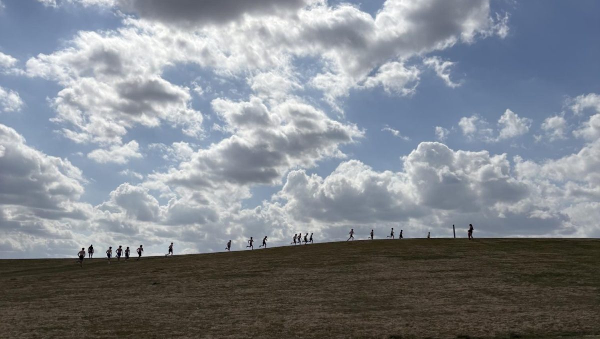 Runners practice at Mount Trashmore City Park on March 31. Coach Michael Nestor led the team in practice. Photo used with permission from Nathan Crickard.
