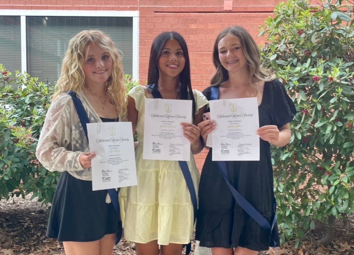 Pictured from left to right: Rylie Dillon, Emerie Stimmel and Acelyn Juhas take a picture after NHS inductions. The three look forward to future NHS projects. Photo used with permission of Emerie Stimmel.