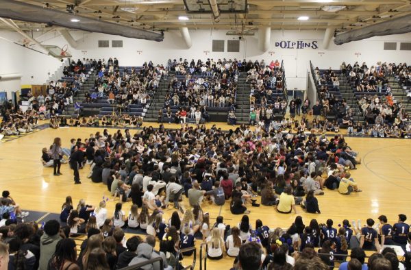 The class of 2026 gathers on the floor at the end of the spring assembly on March 25 while Yolanda Boothe gives her annual "I Am Somebody" speech. This marked the last assembly for the seniors of Ocean Lakes High School and the beginning of their final steps to graduation. 
