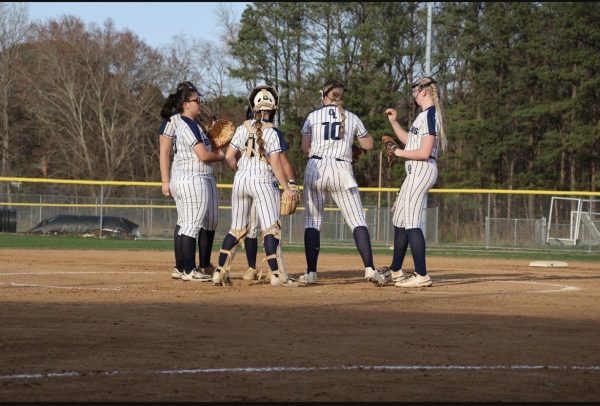 Team huddles hopes for a win at the pitchers mount at their scrimmage against Western Branch in early March as preparations for the season. Photo used permission Ipper Smith.