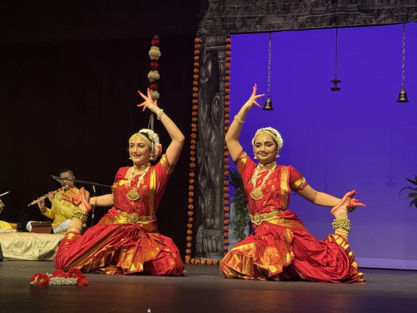 Ami (left) and Mia (right) assume their final pose on April 3, 2026. This ended their last piece, Thillana, and preceded their graduation ceremony.