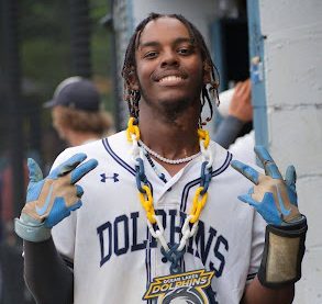 Junior Seinko Augins celebrates with a photo wearing the Ocean Lakes Dolphins chain following his game-sealing grand slam. Ocean Lakes beat Kellam 8-3 in the VA Class 5 Region A Quarterfinals on May 27. Photo used with the permission of Seinko Augins 